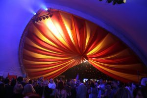 SaddleSpan tent lit up for a party
