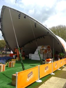 Saddlespan at spring time outdoor event with branded enclosure