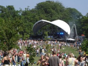 SaddleSpan in the background of a sunny festival site